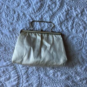 Off white clutch with gold handles